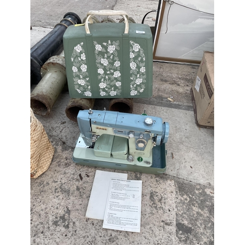 1912 - A RETRO JONES SEWING MACHINE WITH CARRY CASE