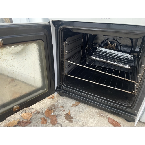 2369 - A BLACK AND WHITE HOTPOINT ELECTRIC FREESTANDING OVEN AND HOB