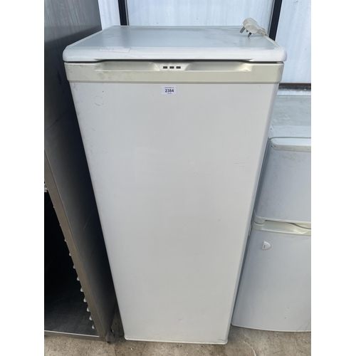 2384 - A TALL WHITE UPRIGHT FREEZER