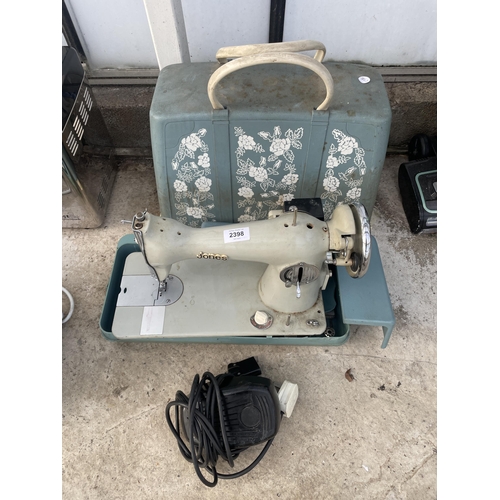 2398 - A RETRO JONES ELECTRIC SEWING MACHINE WITH FOOT PEDAL AND CARRY CASE