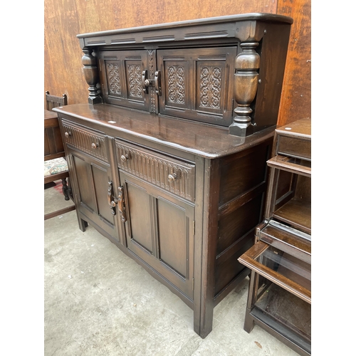 2531 - A REPRODUCTION OAK COURT CUPBOARD WITH CARVED PANEL DOORS AND DRAWERS, 51