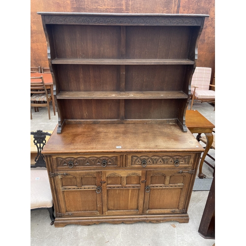 2594 - A REPRODUCTION OAK DRESSER COMPLETE WITH RACK, THE BASE ENCLOSING TWO DRAWERS AND TWO CUPBOARDS, 49