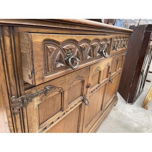 2594 - A REPRODUCTION OAK DRESSER COMPLETE WITH RACK, THE BASE ENCLOSING TWO DRAWERS AND TWO CUPBOARDS, 49