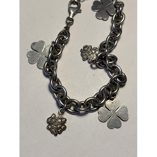 543 - TWO SILVER BRACELETS WITH CHARMS