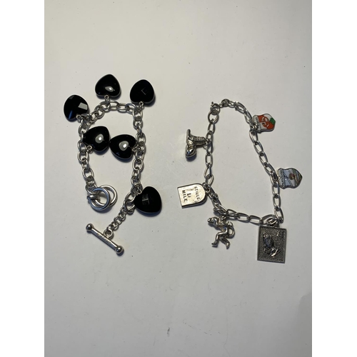 553 - TWO SILVER BRACELETS WITH CHARMS