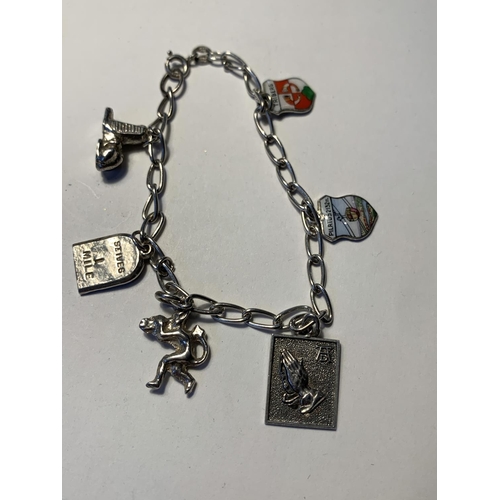 553 - TWO SILVER BRACELETS WITH CHARMS