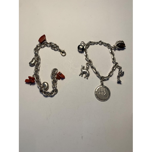 562 - TWO SILVER BRACELETS WITH CHARMS