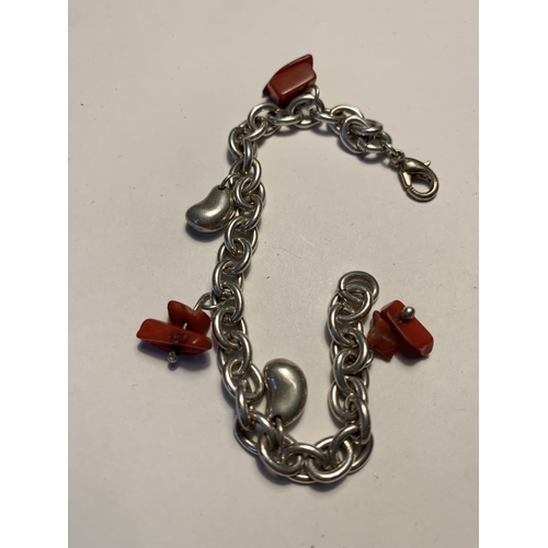 562 - TWO SILVER BRACELETS WITH CHARMS