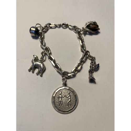 562 - TWO SILVER BRACELETS WITH CHARMS