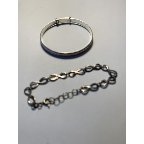 565 - TWO SILVER BRACELETS TO INCLUDE A BANGLE