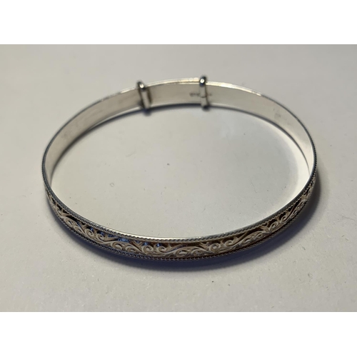 565 - TWO SILVER BRACELETS TO INCLUDE A BANGLE