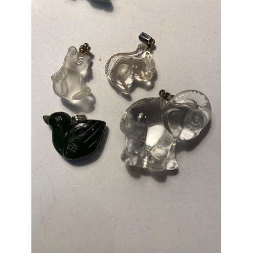 569 - EIGHT CRYSTAL AND JADE PENDANTS