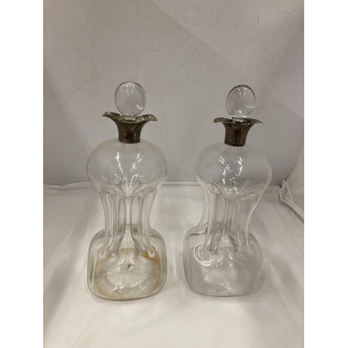 2 - A PAIR OF HALLMARKED BIRMINGHAM SILVER COLLARED GLUG DECANTERS WITH PINCHED AND FLUTED CENTRAL WAIST... 