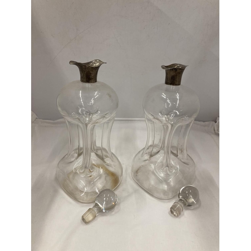 2 - A PAIR OF HALLMARKED BIRMINGHAM SILVER COLLARED GLUG DECANTERS WITH PINCHED AND FLUTED CENTRAL WAIST... 