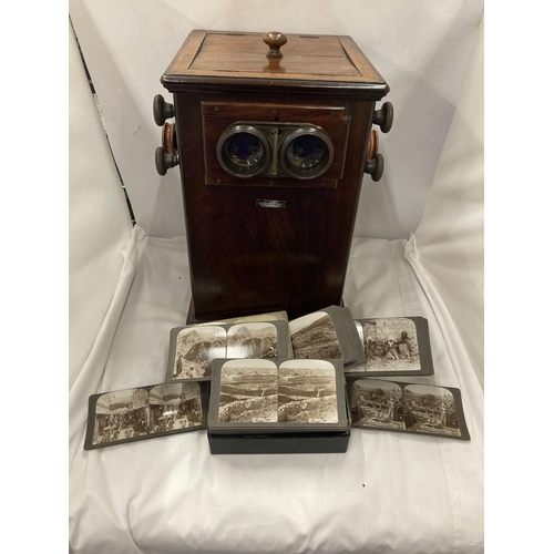 8 - A VINTAGE REVOLVING STEREOSCOPE VIEWER WITH A BOXED SET OF CARD