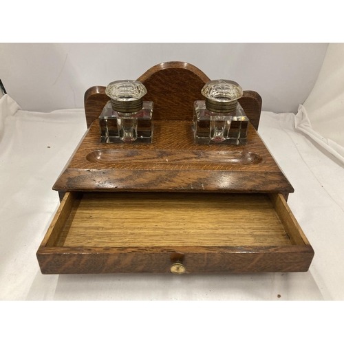 9 - A DESK SET WITH LOWER DRAWER AND TWO ORIGINAL GLASS BOTTLES