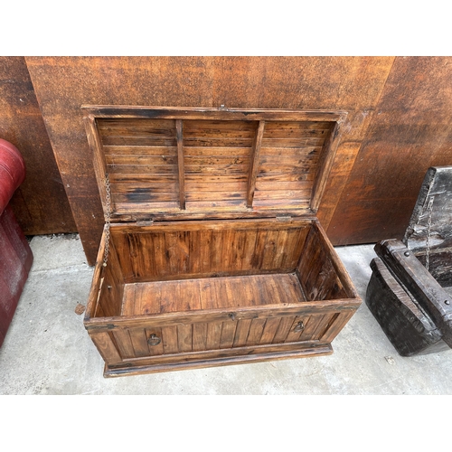 2507 - A DOMED HARDWOOD TRUNK WITH METAL BANDING AND RING HANDLES TO THE SIDES AND ENDS - 36