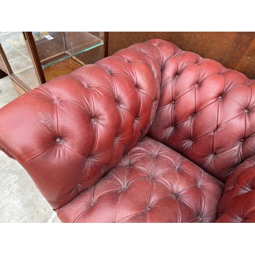 2508 - AN OXBLOOD BUTTONED LEATHER ARMCHAIR