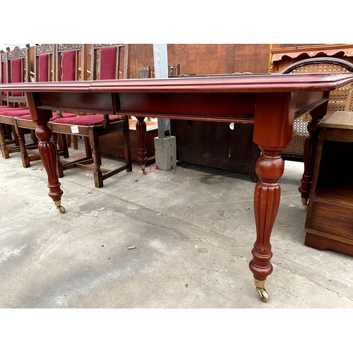 2683 - A VICTORIAN STYLE PULL OUT DINING TABLE ON TURNED AND FLUTED LEGS WITH BRASS CASTERS, 60