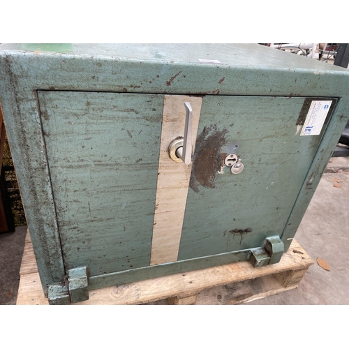 1936 - A LARGE HEAVY DUTY SAFE WITH KEY IN THE OFFICE