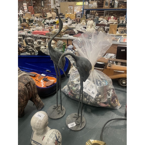 105 - A TALL PAIR OF METAL STORKS, HEIGHT 54CM