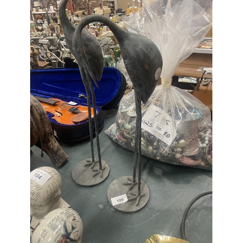 105 - A TALL PAIR OF METAL STORKS, HEIGHT 54CM