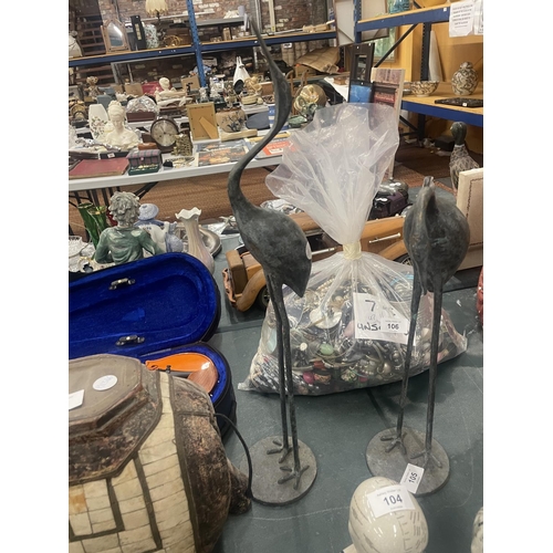 105 - A TALL PAIR OF METAL STORKS, HEIGHT 54CM