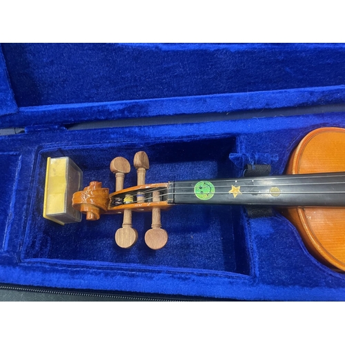 110 - A STENTOR STUDENT 1/4 VIOLIN IN A CASE