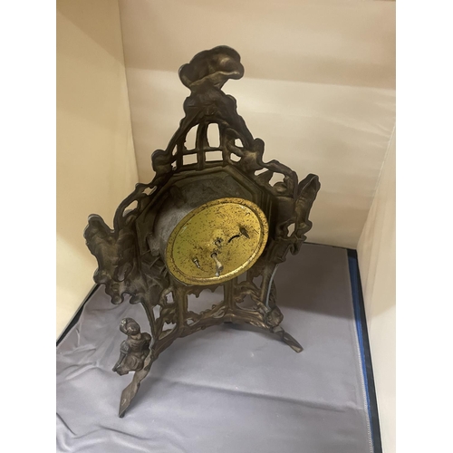 132 - AN ORNATE VINTAGE BRASS STAND UP CLOCK, HEIGHT 36CM