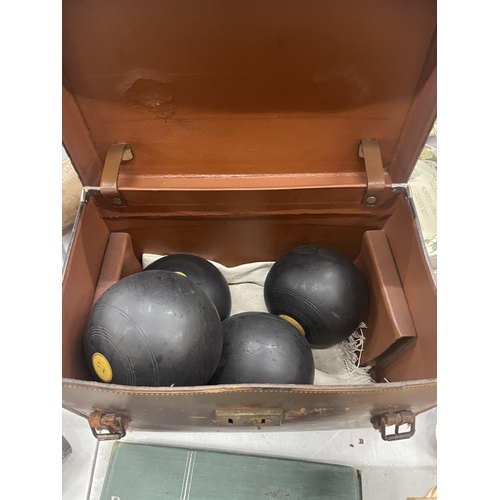 152 - FOUR IDENTICAL BOWLING BOWLS, NUMBERED 1, 2, 3 AND 4 IN A VINTAGE LEATHER CASE