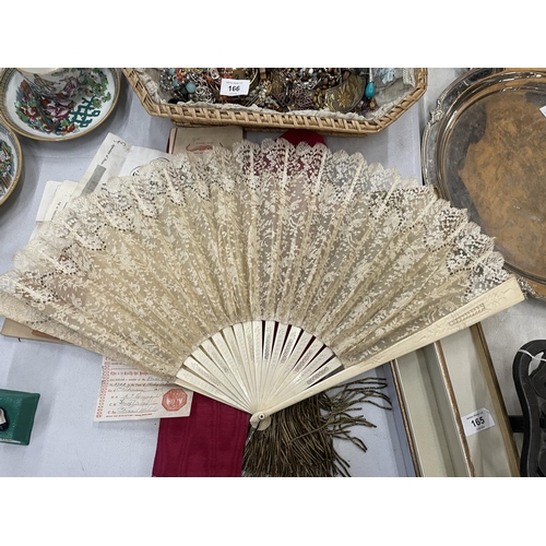 165 - A BOXED BONE AND SILK VICTORIAN FAN