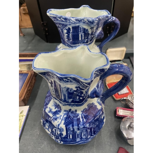 186 - FOUR MATCHING, GRADUATING BLUE AND WHITE IRONSTONE JUGS, LARGEST HEIGHT 23CM