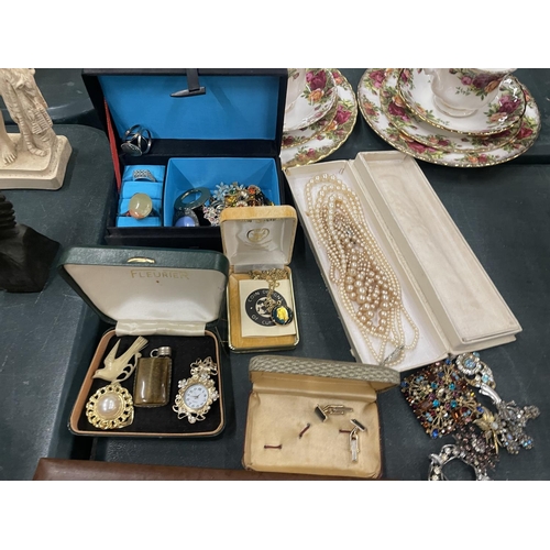 191 - A LARGE QUANTITY OF COSTUME JEWELLERY TO INCLUDE RINGS, CUFFLINKS, BROOCHES, NECKLACES, ETC SOME BOX... 