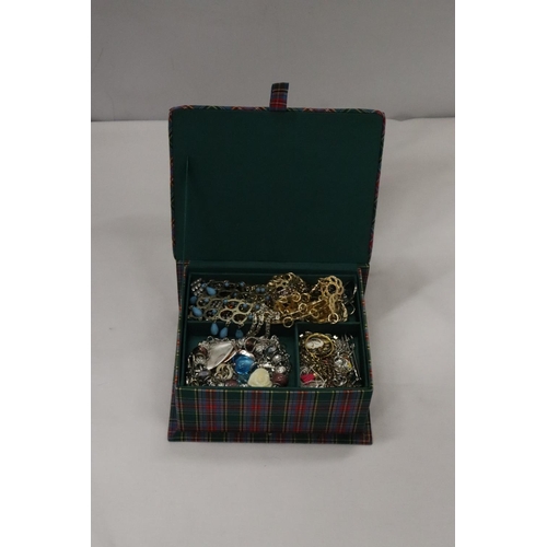 214 - A QUANTITY OF COSTUME JEWELLERY TO INCLUDE NECKLACES, EARRINGS, BRACELETS, ETC IN A PADDED JEWELLERY... 