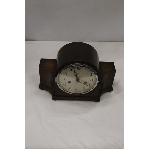 217 - A VINTAGE GERMAN MANTLE CLOCK IN WORKING ORDER AT CATALOGUING, NO WARRANTY GIVEN