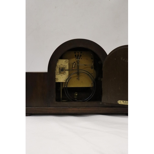 217 - A VINTAGE GERMAN MANTLE CLOCK IN WORKING ORDER AT CATALOGUING, NO WARRANTY GIVEN