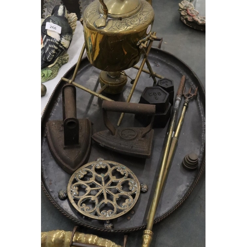 261 - A VINTAGE LOT TO INCLUDE A LARGE METAL TRAY, A BRASS SPIRIT KETTLE AND BURNER, FLAT IRONS, WEIGHTS, ... 