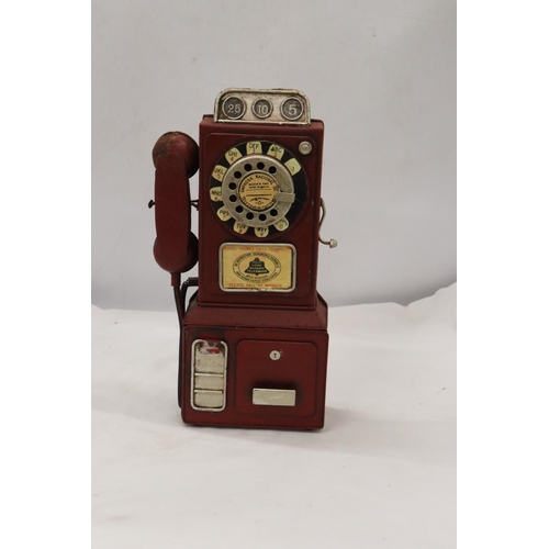 288 - AN UNUSUAL USA VINTAGE TIN PLATE PHONE MONEY BOX, HEIGHT 33CM