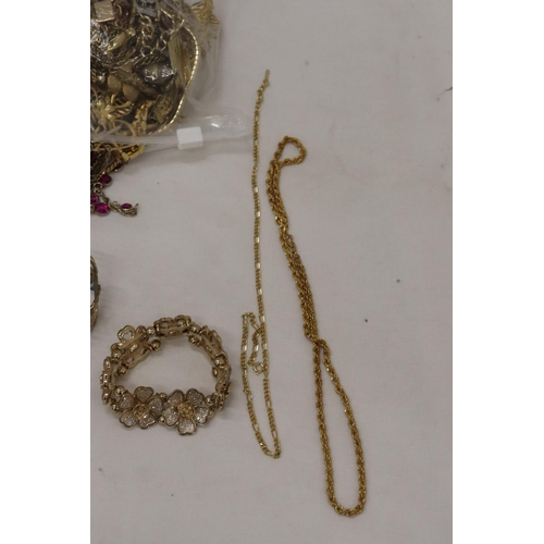 296 - A QUANTITY OF YELLOW METAL COSTUME JEWELLERY TO INCLUDE CHAINS, BRACELETS, ETC