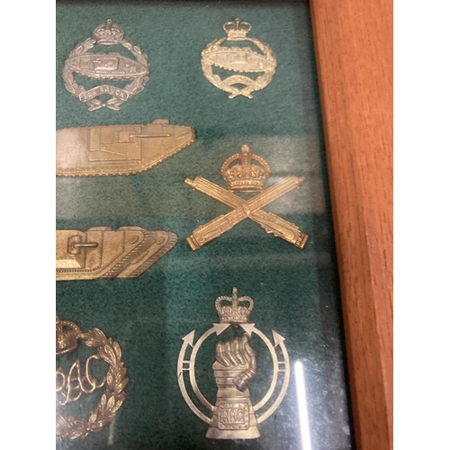 371 - A FRAMED COLLECTION OF TANK CORPS BADGES