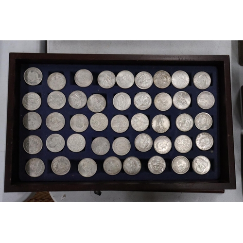 460 - FORTY FOUR VARIOUS VINTAGE TOKENS/COINS IN A WOODEN BOX