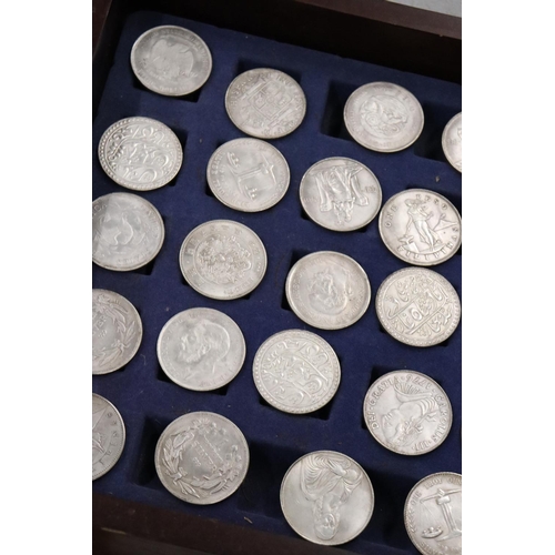 460 - FORTY FOUR VARIOUS VINTAGE TOKENS/COINS IN A WOODEN BOX