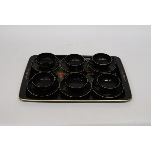 471 - AN ORIENTAL HANDPAINTED, LACQUERED TRAY WITH SIX CUPS AND SAUCERS