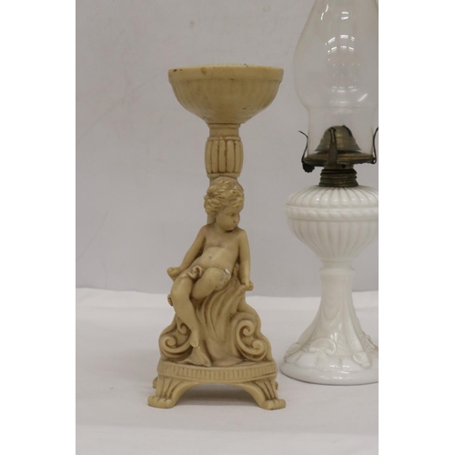 486 - A WHITE BASED GLASS FLUTED SHADE OIL LAMP AND A CHERUB DESIGN FLOWER ARRANGIMG STAND