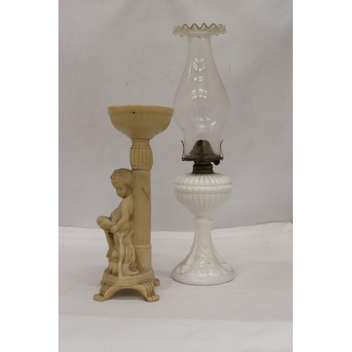 486 - A WHITE BASED GLASS FLUTED SHADE OIL LAMP AND A CHERUB DESIGN FLOWER ARRANGIMG STAND