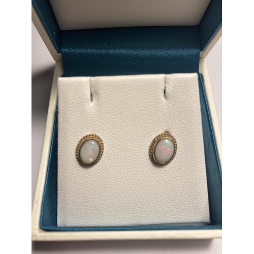 574 - A PAIR OF 9 CARAT GOLD AND OPAL EARRINGS IN A PRESENTATION BOX