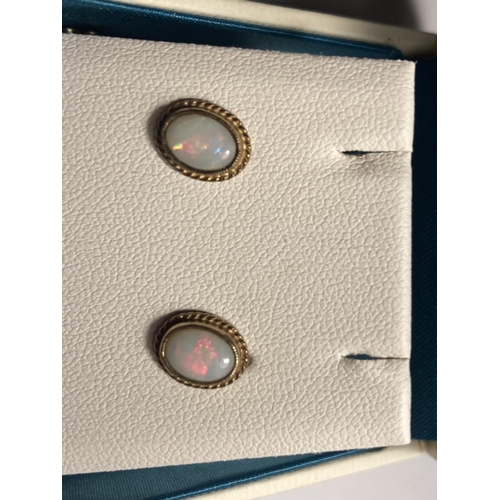 574 - A PAIR OF 9 CARAT GOLD AND OPAL EARRINGS IN A PRESENTATION BOX