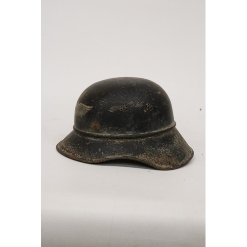 396 - A WORLD WAR II NAZI GERMANY LUFTSCHUTZ PAINTED METAL HELMET AND LINER