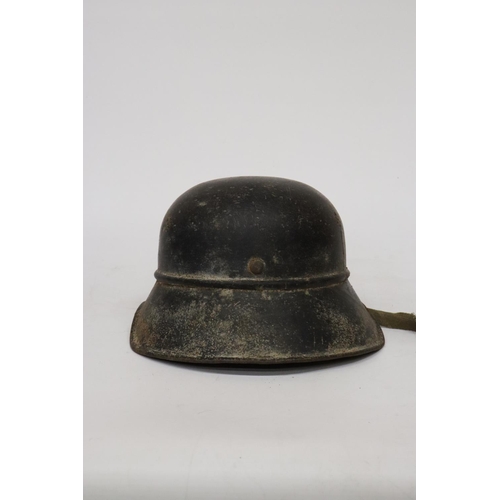 396 - A WORLD WAR II NAZI GERMANY LUFTSCHUTZ PAINTED METAL HELMET AND LINER