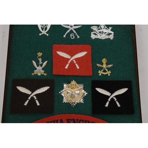 402 - A CASED COLLECTION OF GURKHA BADGES